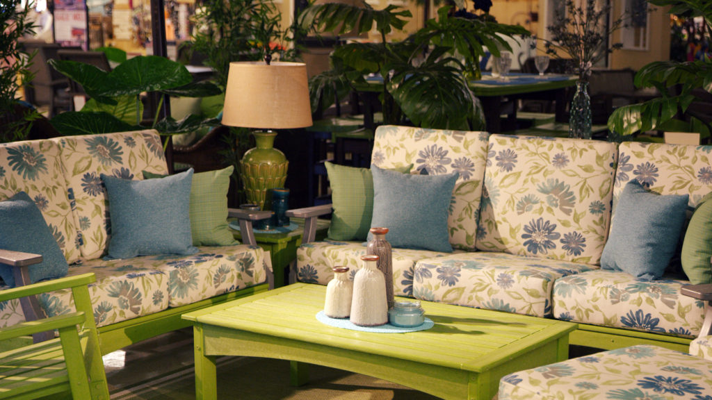 white with blue floral patio furniture and green table