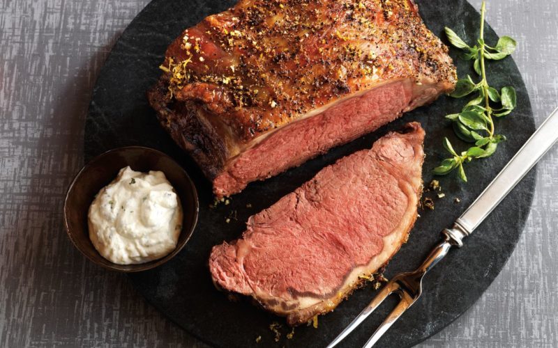 a plated serving of lemon garlic roast with herbed oregano horseradish sauce