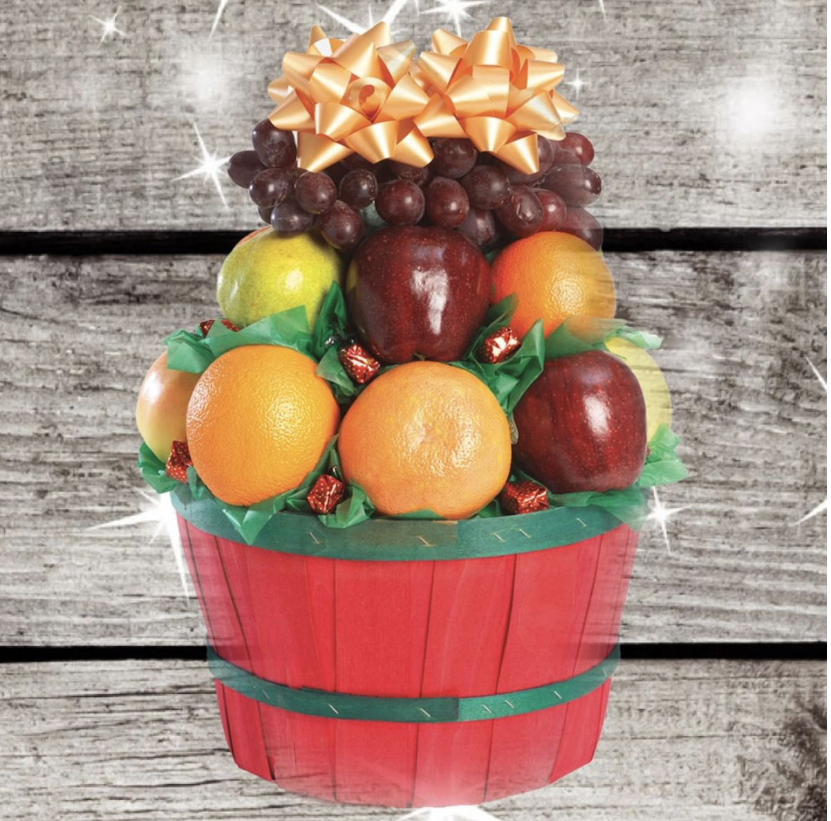 fruit basket with oranges, apples, grapes, and pears