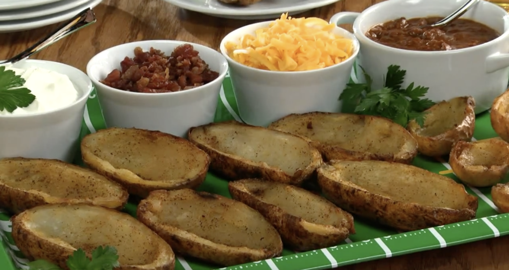 platter of potato skins with bowls of toppings