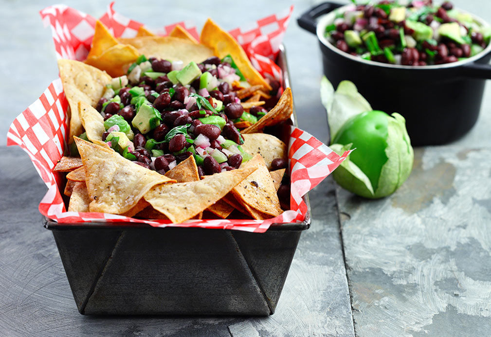 bowl of black bean and avocado salsa with corn tortilla chips