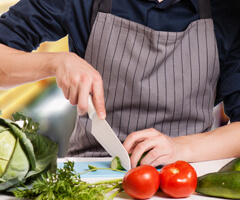 person chopping veggies