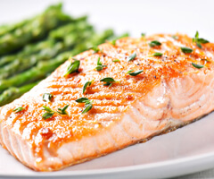 salmon on plate with asparagus