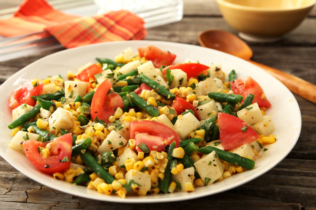 corn tomato salad in serving dish on picnic table