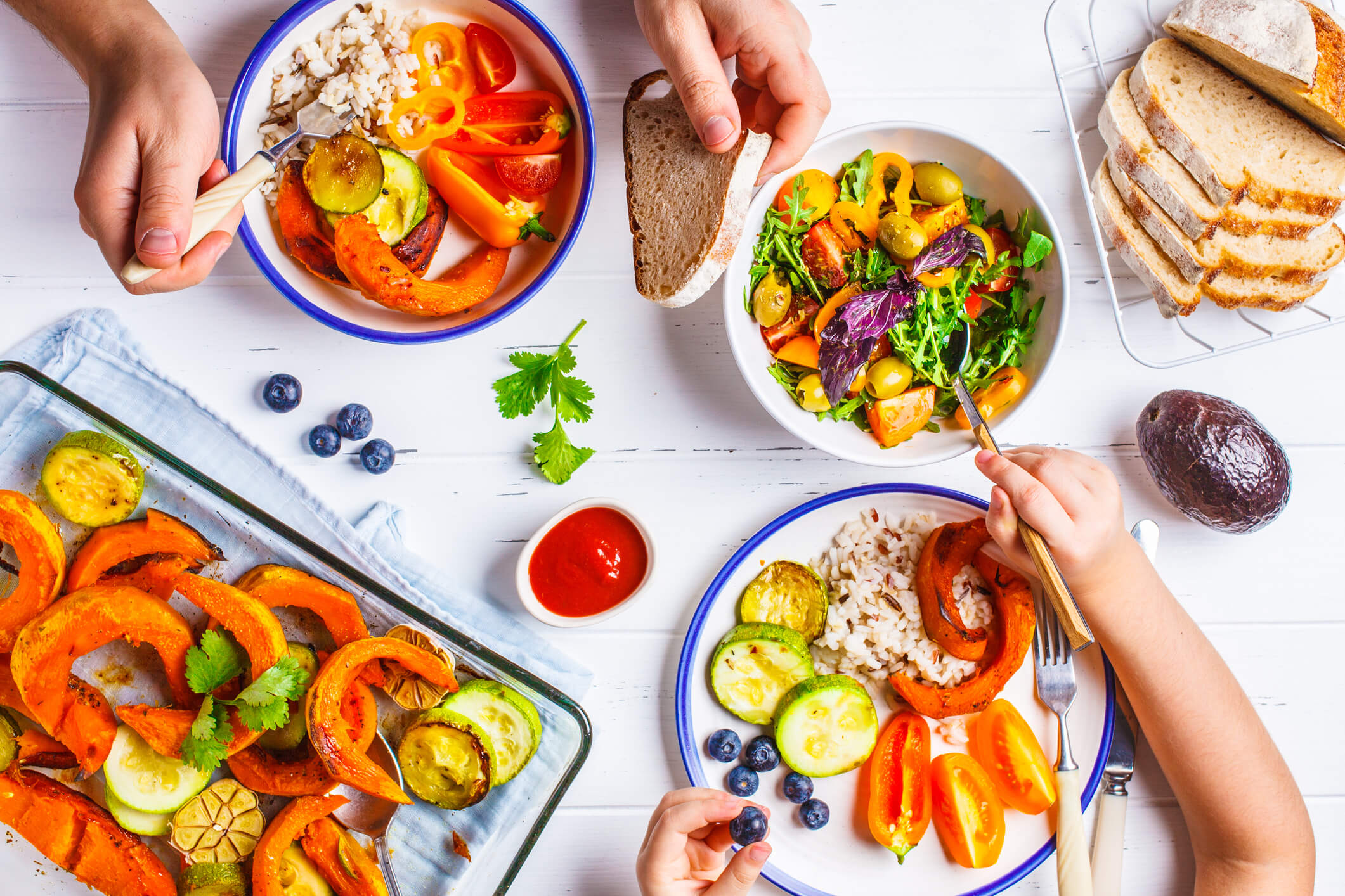 Types of organic foods can be incorporated into every recipe. Shown are bowls of salad and an organic meal.