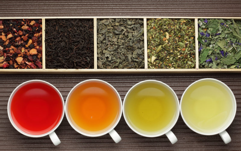 Cups and containers of different types of tea