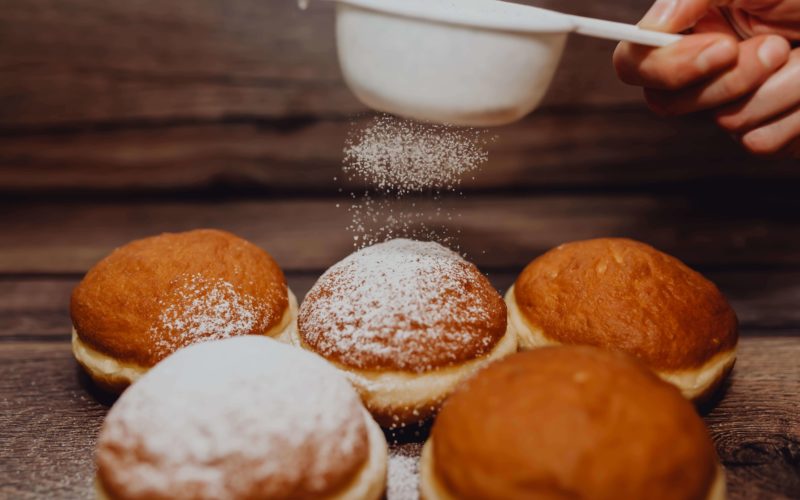 Fasnacht donuts with powdered sugar.