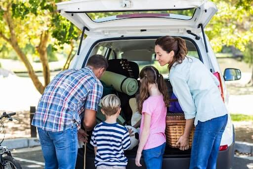 Family packing for a road trip.