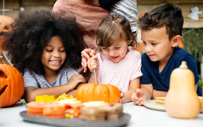 Kids painting pumpkins