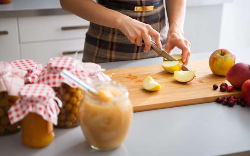 Woman cooking with apples.