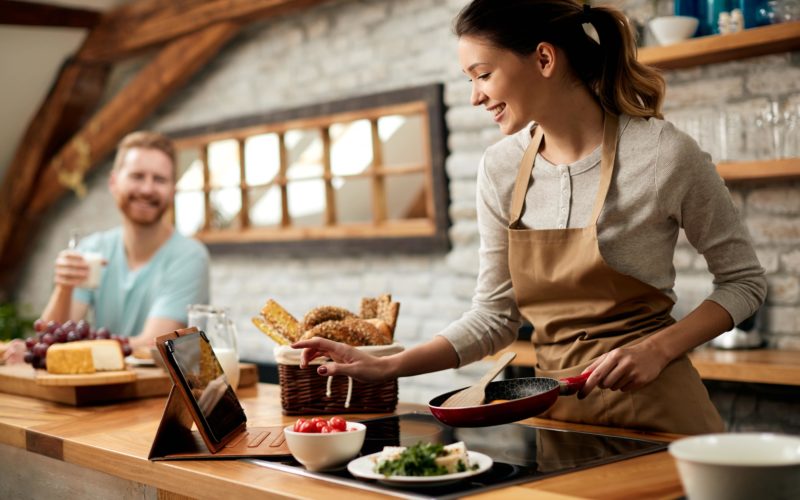 Woman cooking with ingredient substitutions.