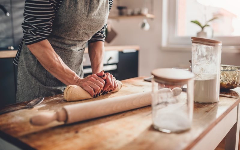 Woman making dough from scratch.